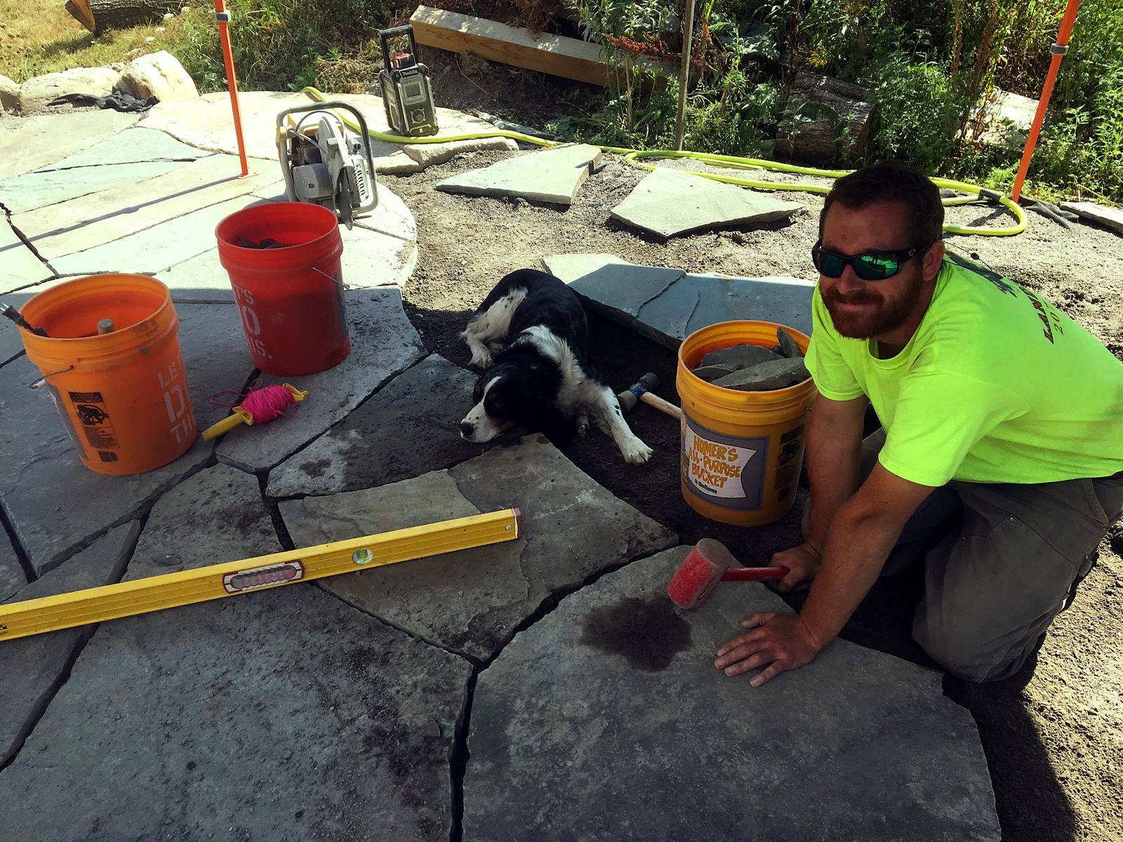 Flagstone being set and leveled