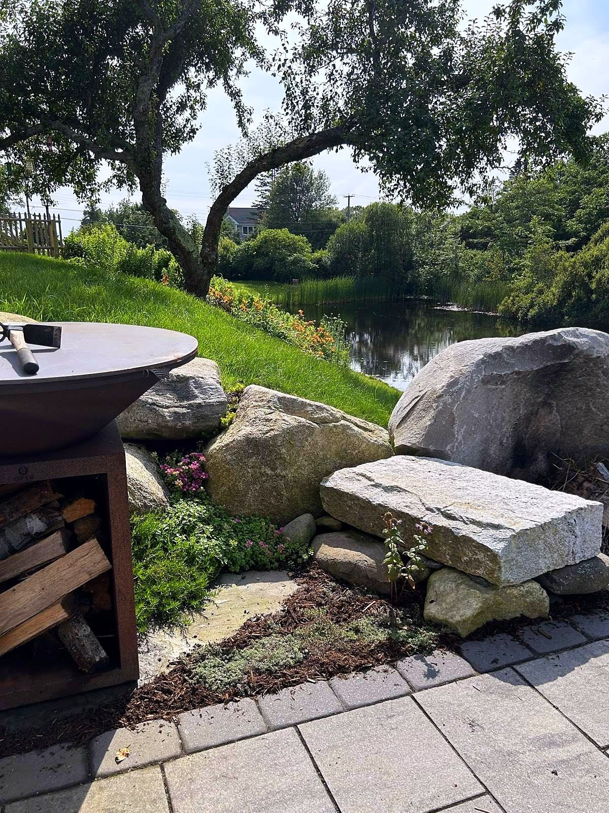Patio edge with boulders and plantings