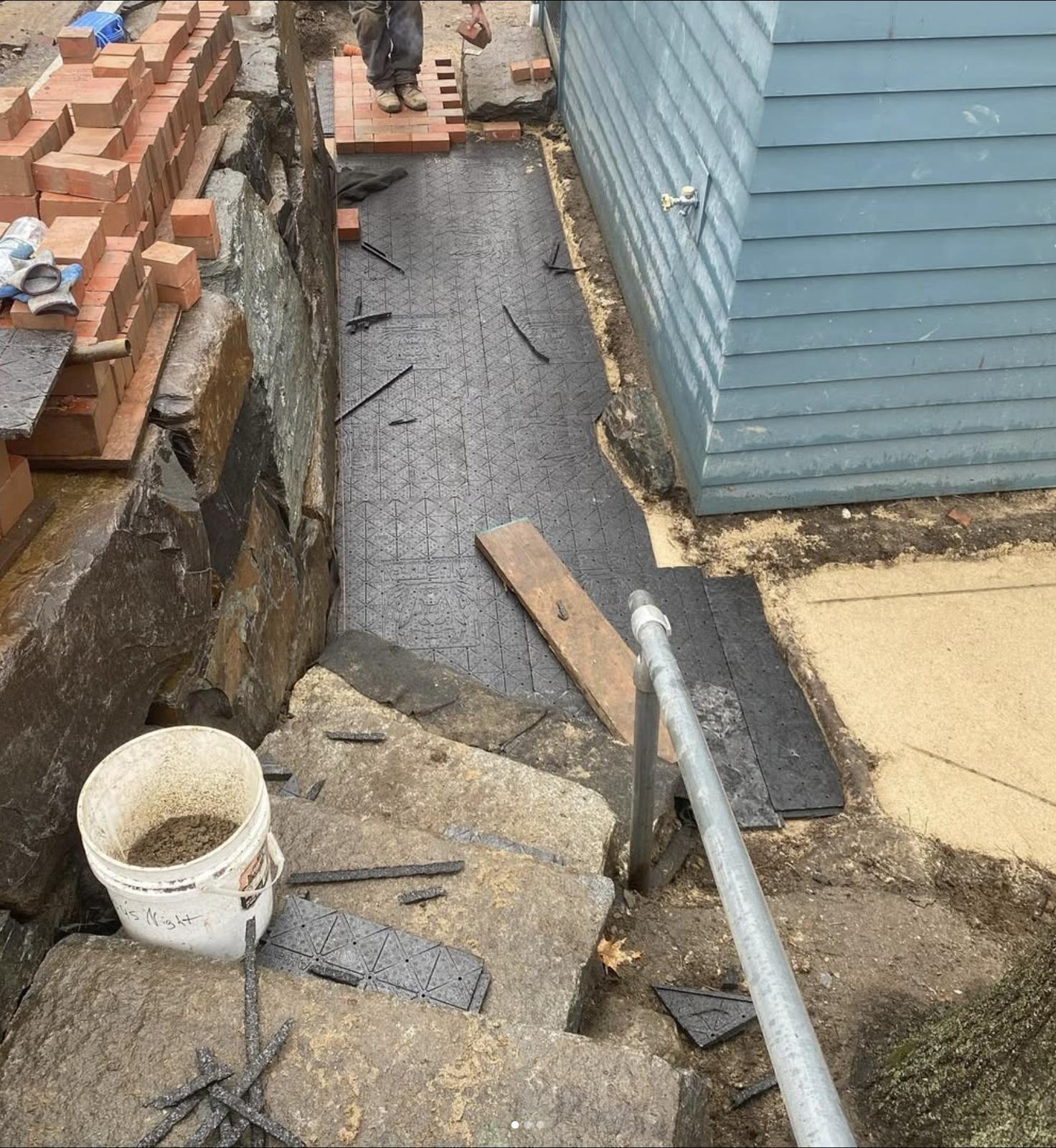 Preparing the base layers for the brick walkway