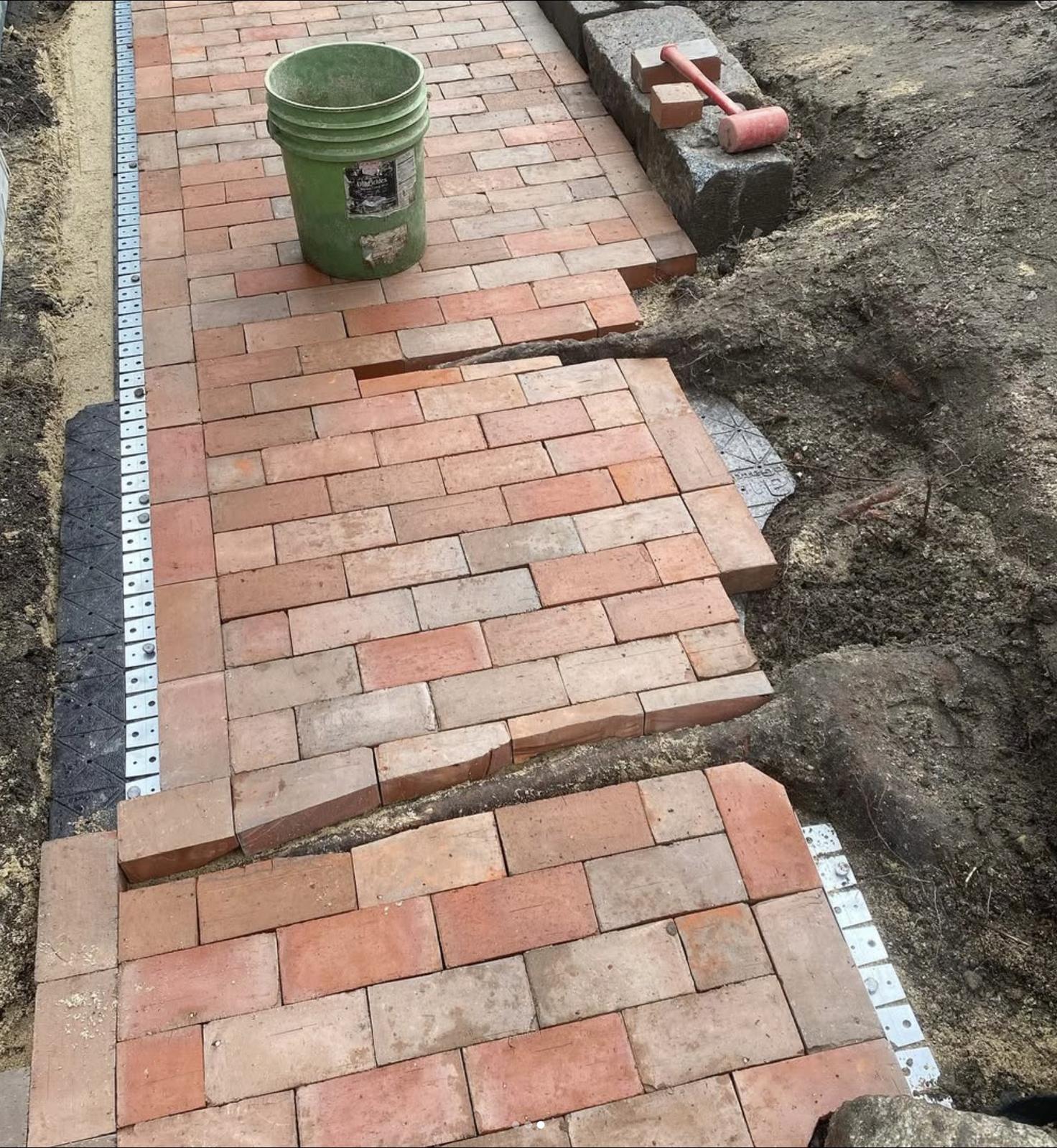 Brick walkway going down over the roots