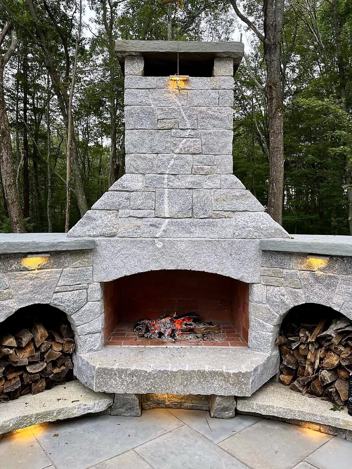 Stone fireplace with fire burning