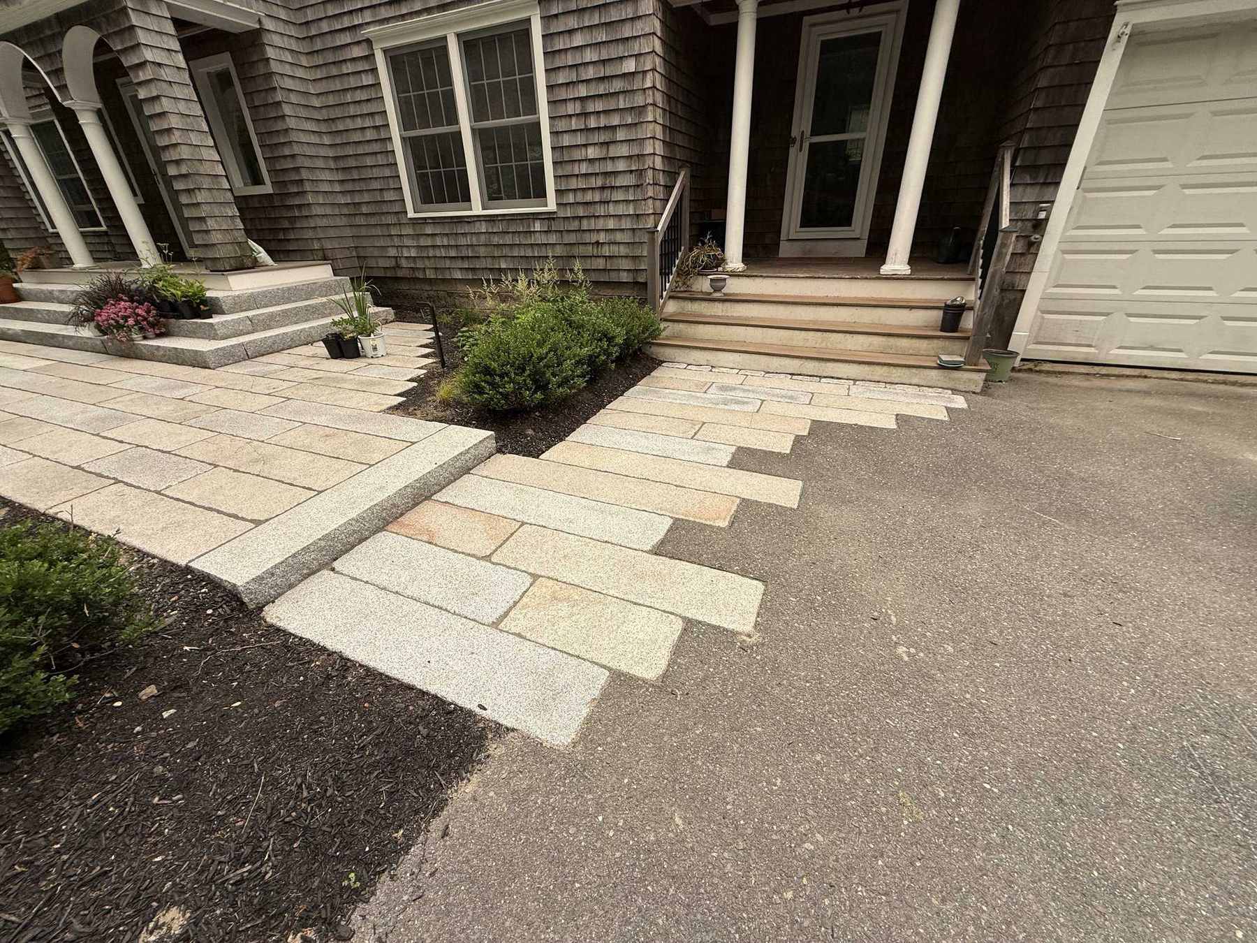 Front entry with granite steps and reclaimed granite patio