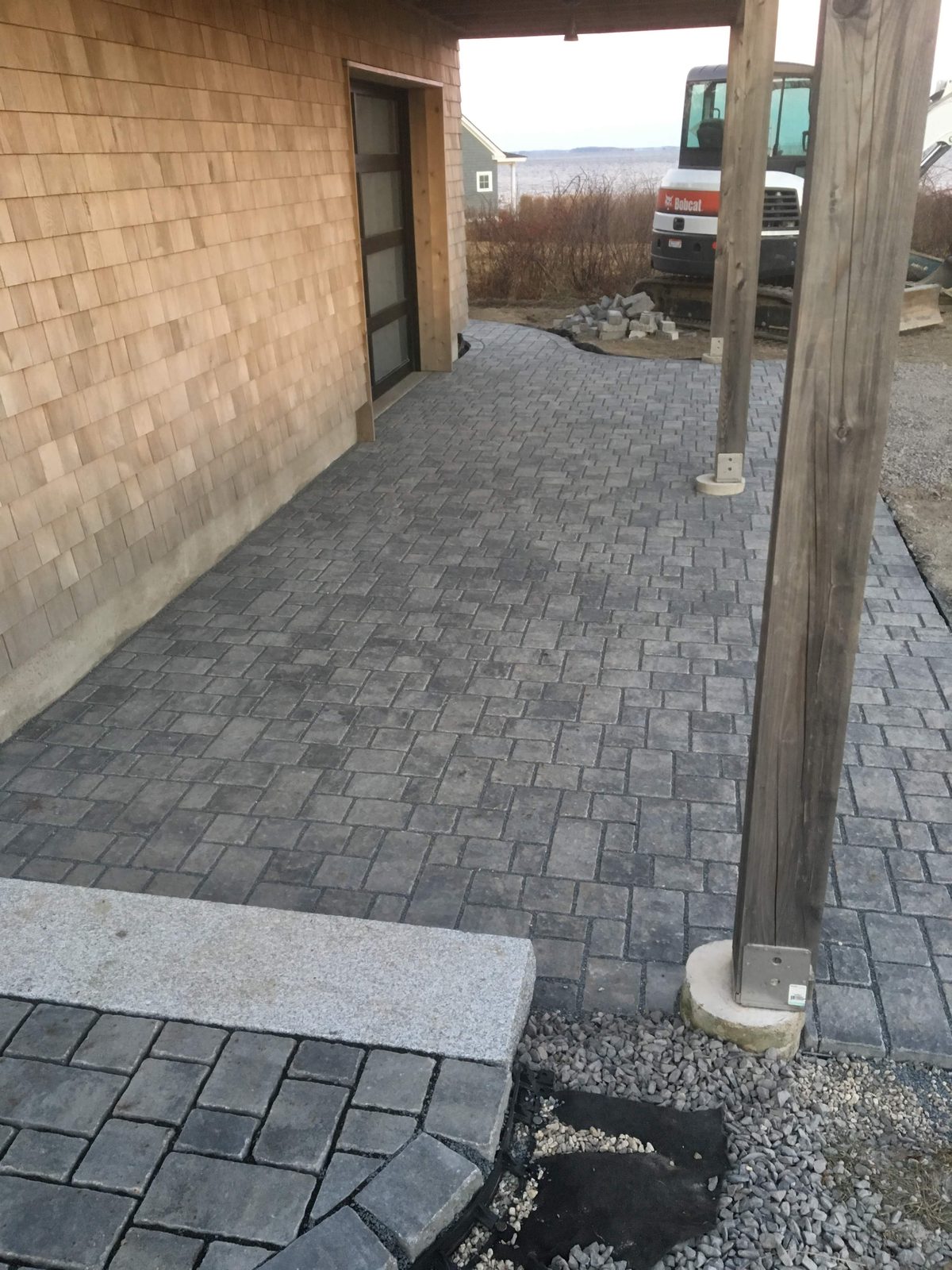 Paver patio with stone stairs
