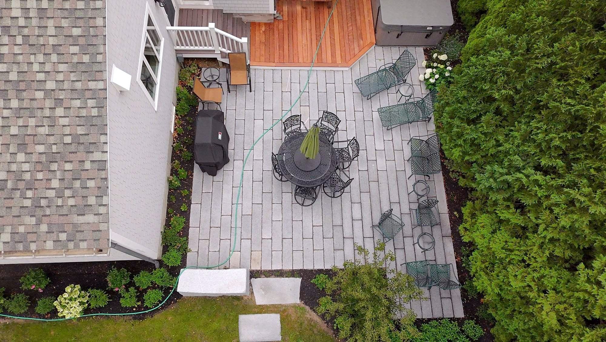 Hot tub and granite plank patio, aerial view