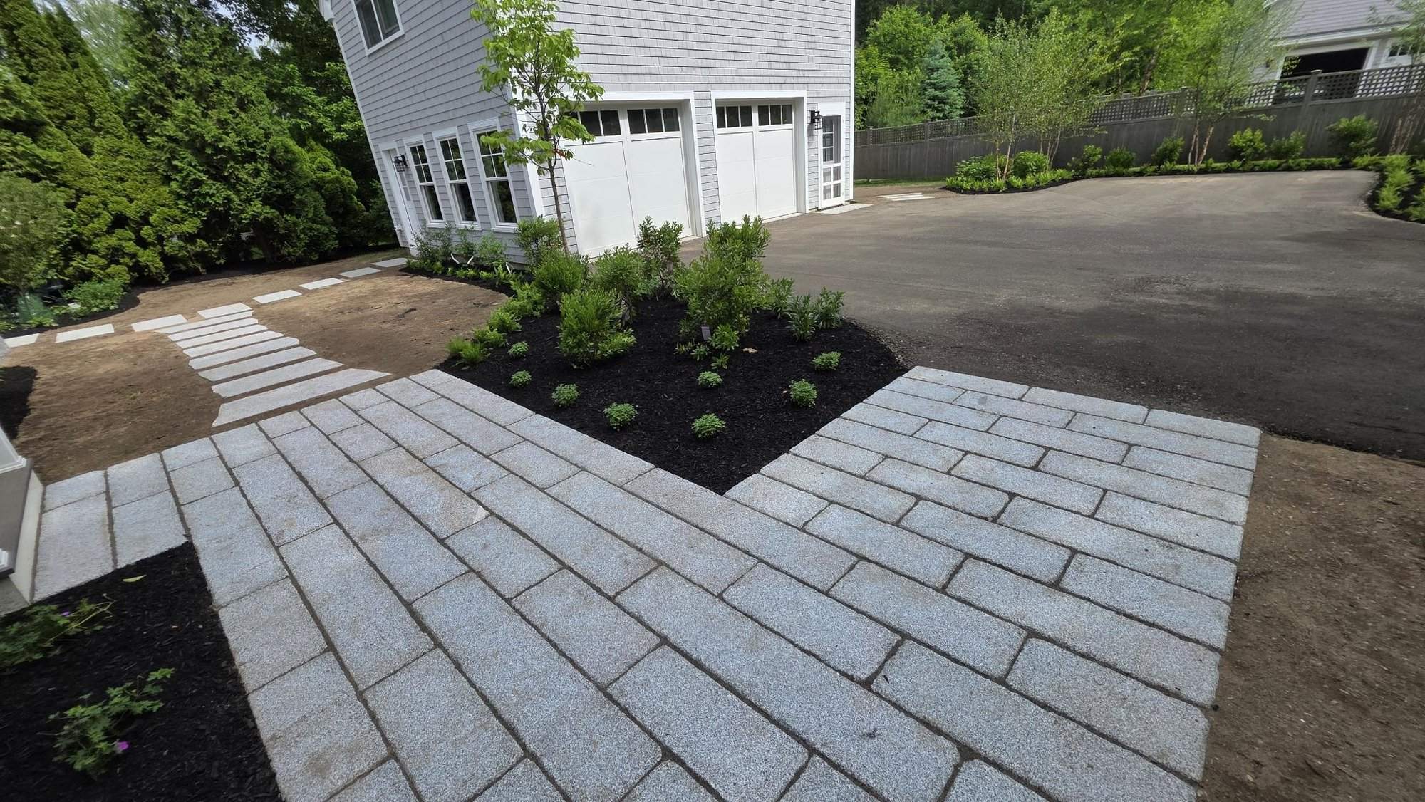 Granite plank patio meeting the driveway
