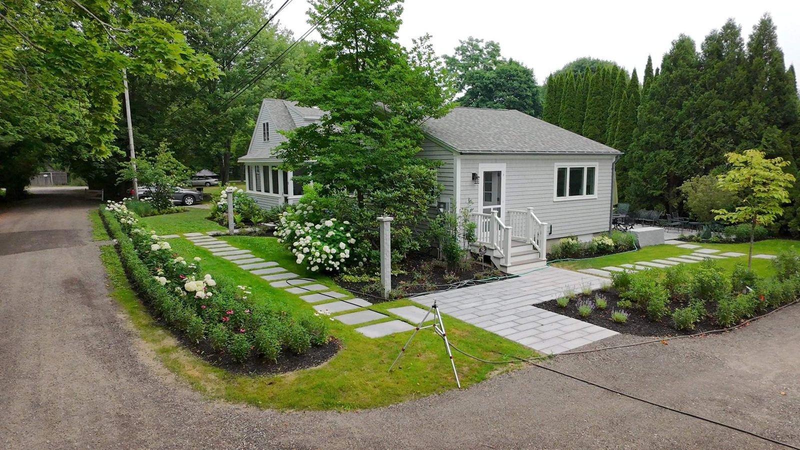 The finished front walkway, gardens and house