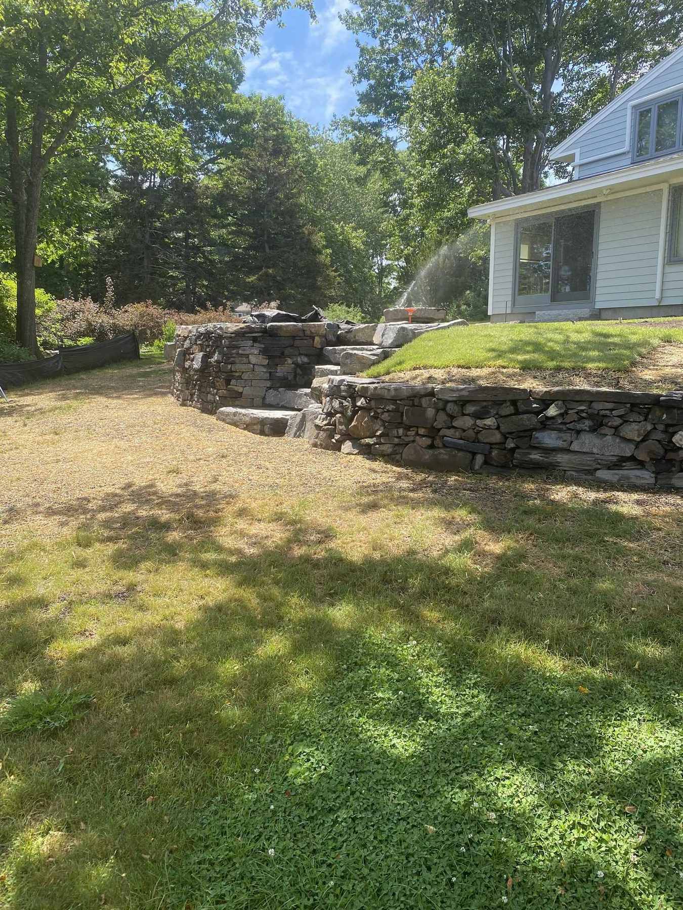 Stone walls and steps seen from the lawn