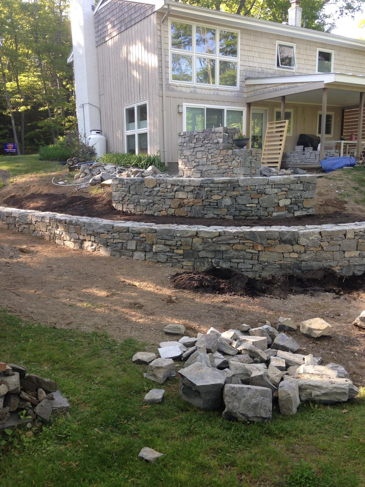 Curved stone wall built up in tiers