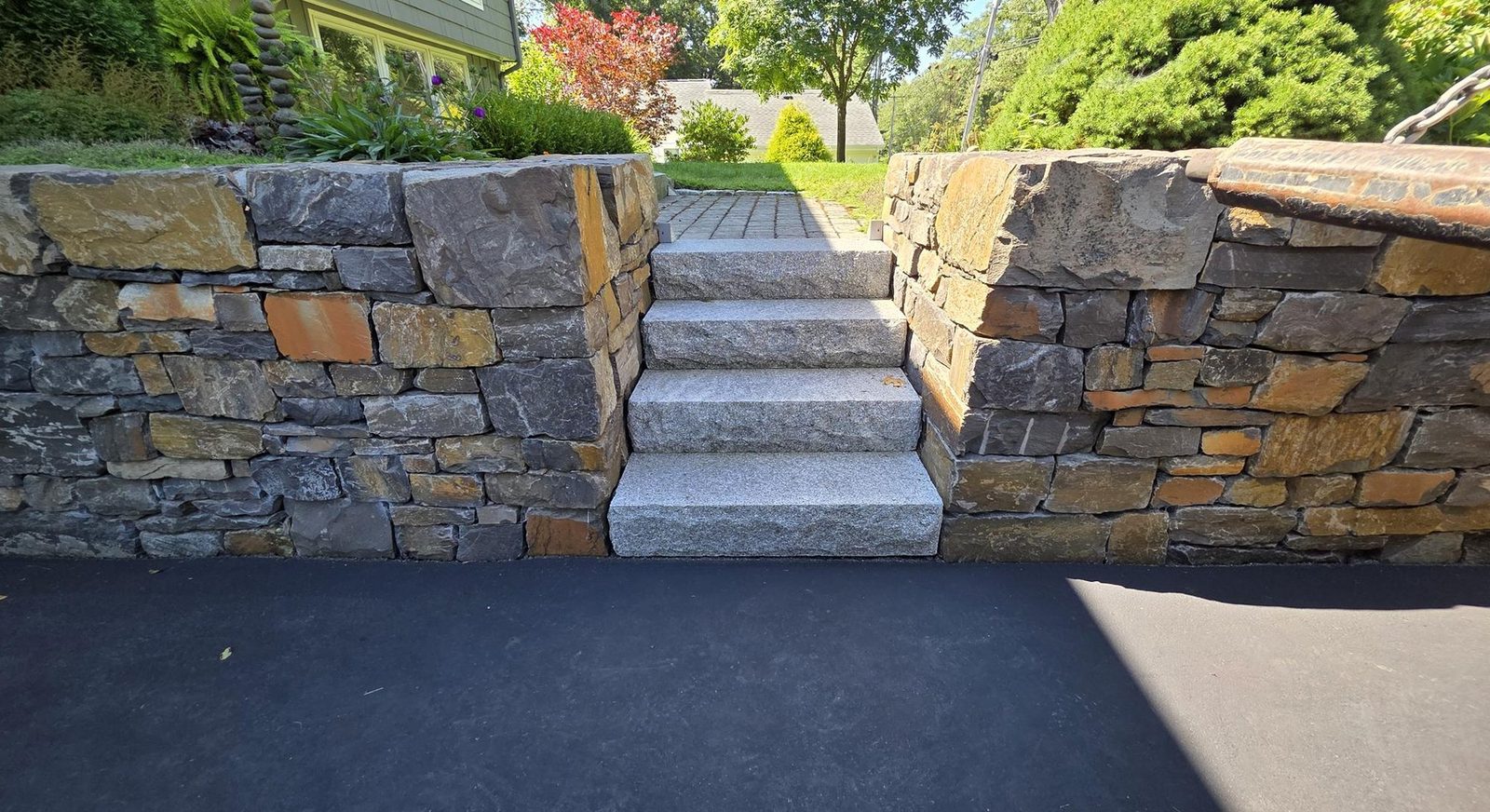 Granite steps set between two fieldstone walls