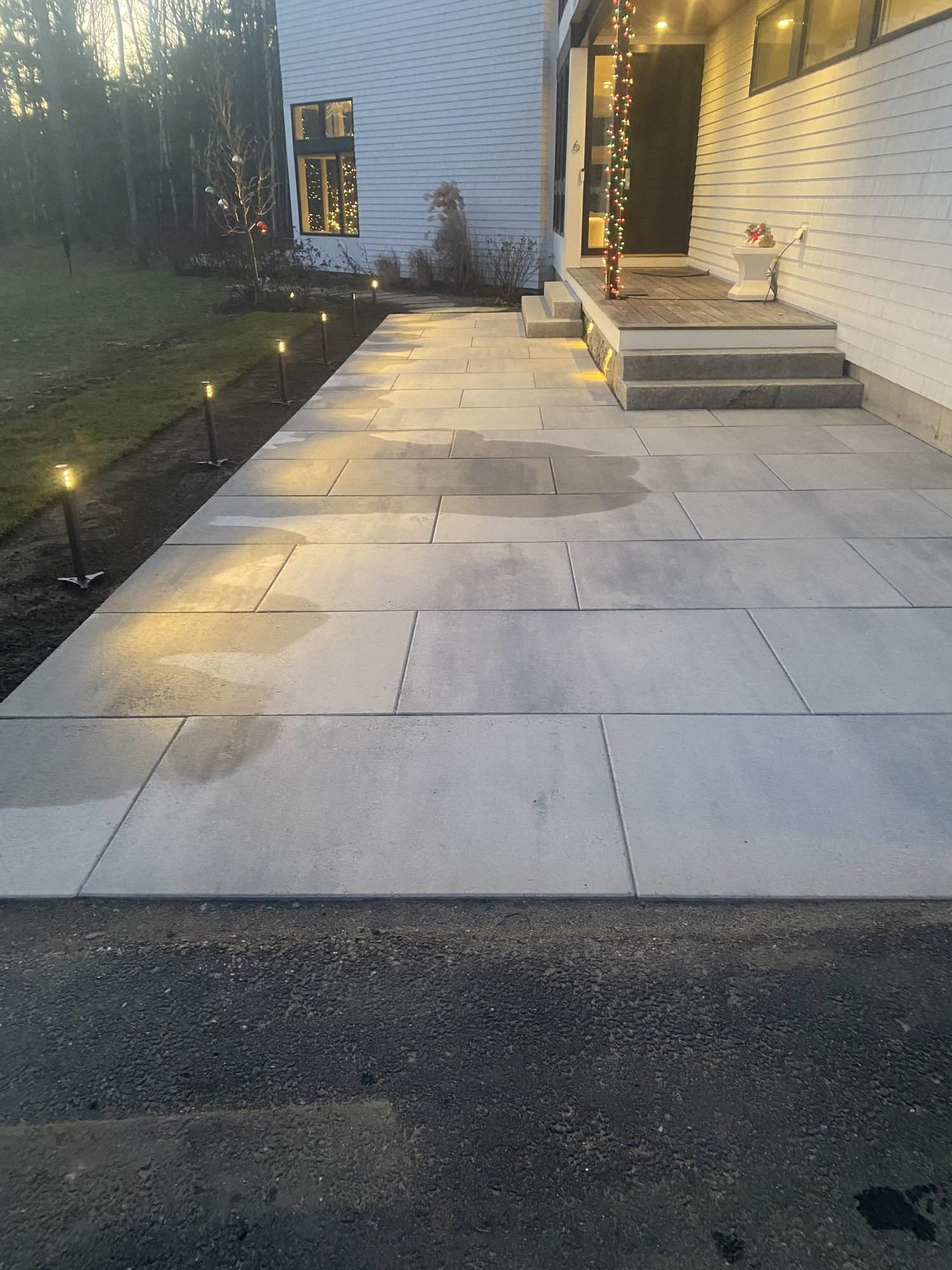 Stone stairs leading to a paver patio