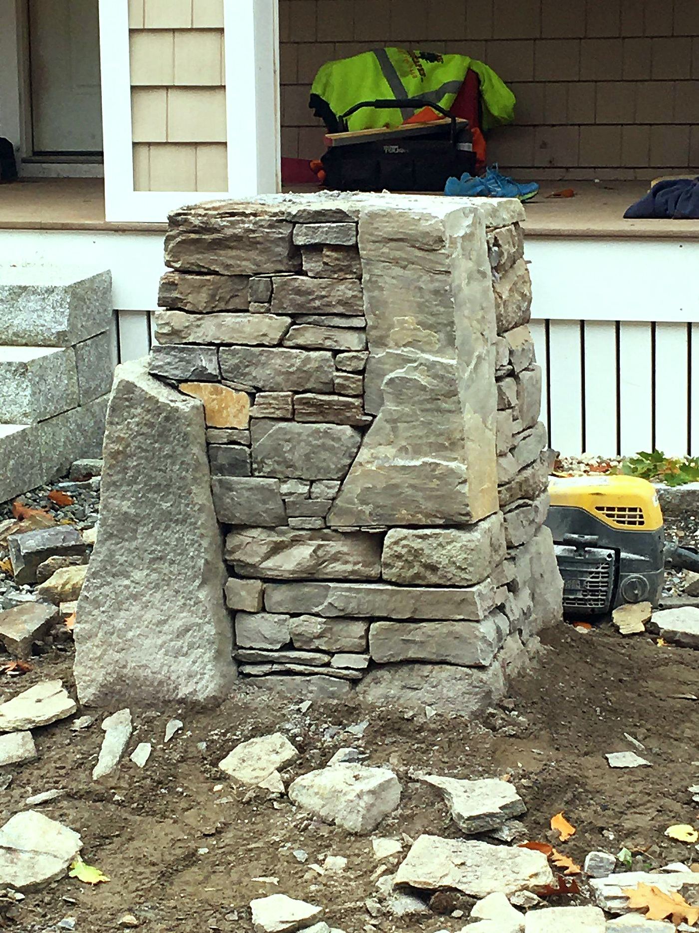 Dry-stacked fieldstone wall and pillar